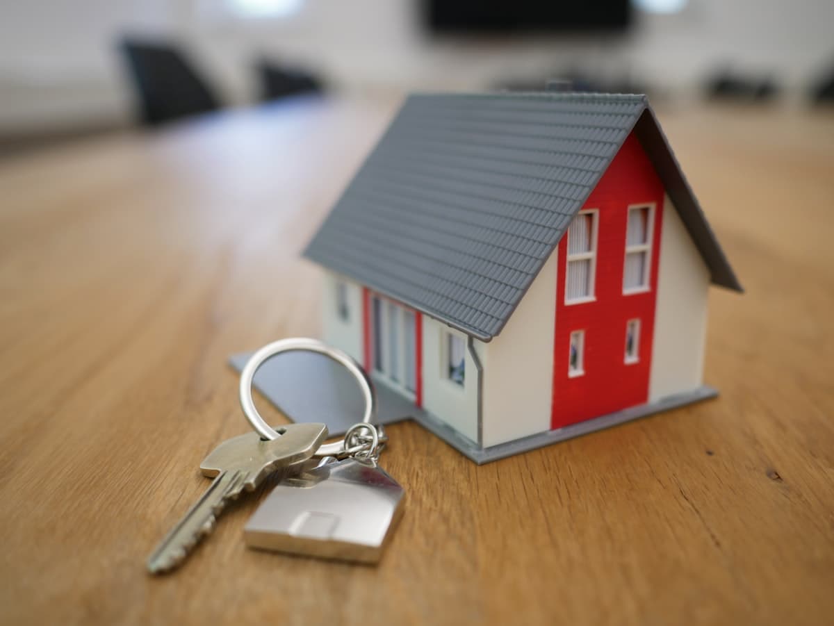 House keys on an open palm — used for Real Estate Investor (hero).