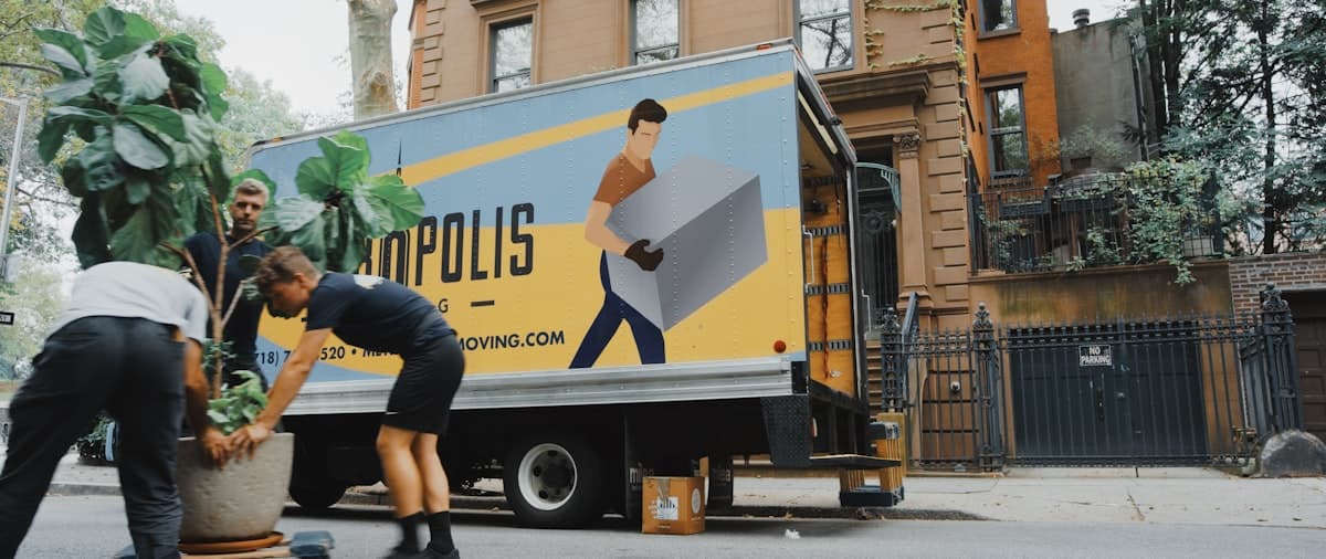 Moving boxes stacked by a front door — used for Corporate Relocation (hero).